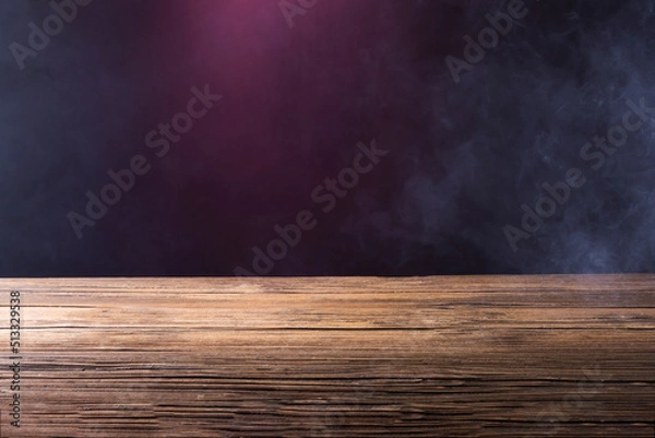 Fototapeta An old brown wooden floor or an empty table with white mist or smoke. on a black background
