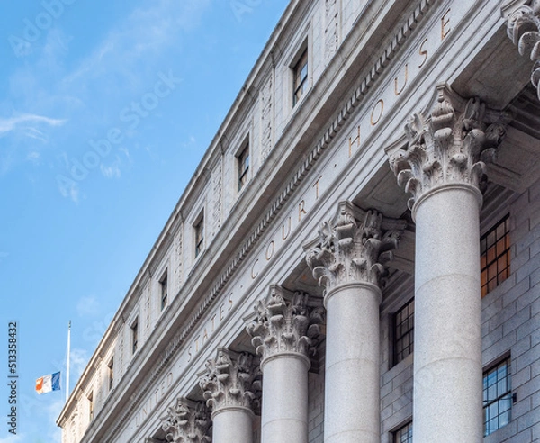 Fototapeta The main entrance of the Thurgood Marshall US Courthouse in NYC is listed on the National Register of Historic Places. The Corinthian columns and the frieze are carved with a detailed floral design.