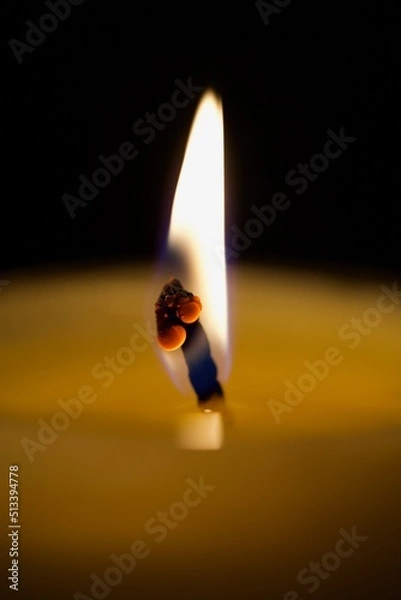 Obraz burning candle in the dark