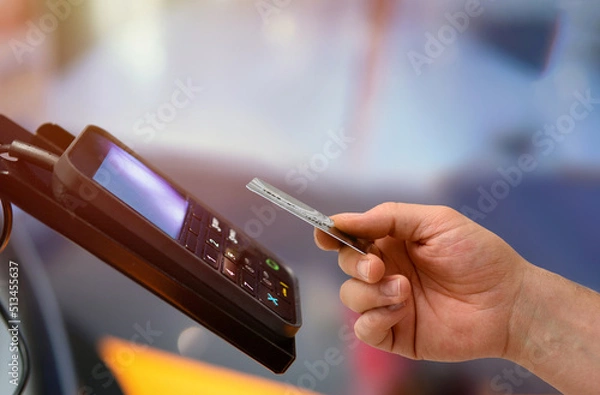 Fototapeta contactless payments from pos device via credit card