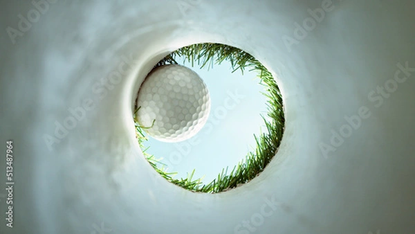 Fototapeta Detail of golf ball, view from inside the hole.
