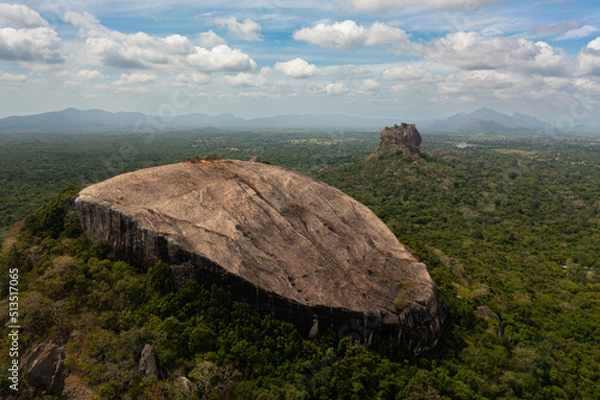 Fototapeta Sigiriya mountain and Pidurangala rock among the dense forest on the island of Sri Lanka. Tropical green forest and jungle.