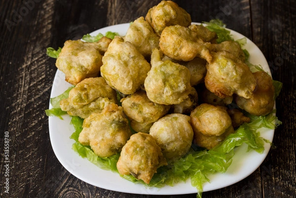 Obraz Seaweed fritters, or zeppoline, are small pieces of deep-fried grown dough typical of the Neapolitan tradition.