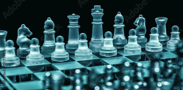 Obraz Glass chess on chess board. Photographed up close with the black background.