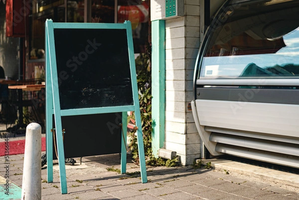 Fototapeta Cafe blank signboard on the street mock up