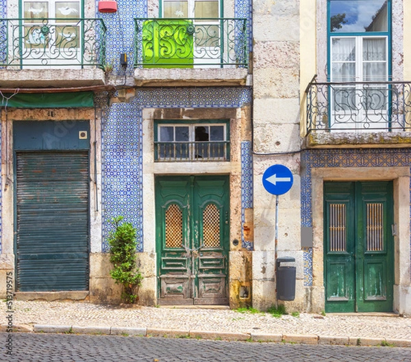 Obraz Fragment of the facade of the house with decorative elements and azulejo tiles. Lisbon, Portugal