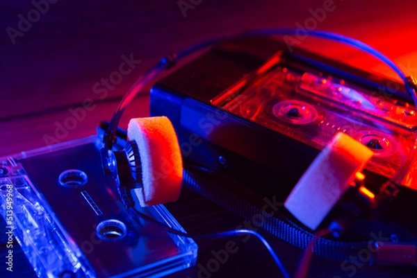 Fototapeta Vintage cassette tape player in neon light. 80s - 90s advertisement style. Disco party nostalgy concept