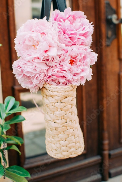 Fototapeta basket bag with pink peonies