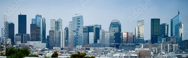 Fototapeta Panoramic view of the skyline of the financial district of La Défense, Paris, France (day time) with a blue sky in the background