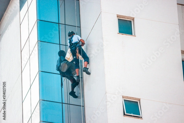 Fototapeta workers on a building