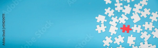 Fototapeta Top view of jigsaw puzzle on blue background