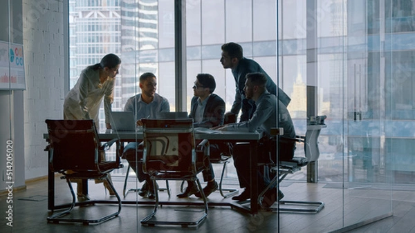 Obraz Corporate teamwork in the middle of a working day in a workplace