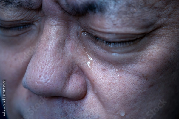 Obraz 涙を流す男性