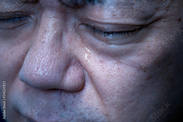 Obraz 涙を流す男性