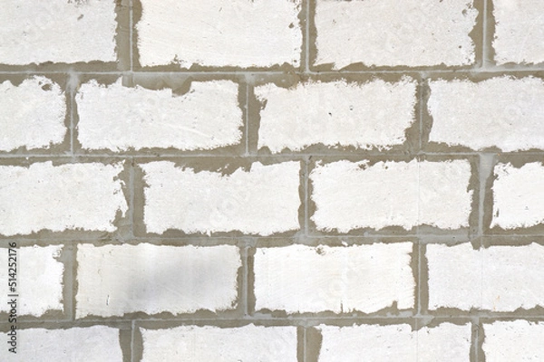 Fototapeta Old brick wall. Ancient stone texture background. Urban background, white ruined industrial brick wall with copy space. Home and office design backdrop. Vintage effect. 