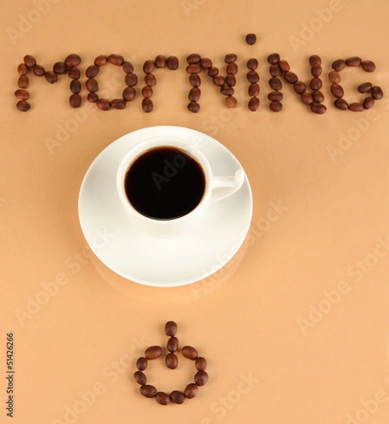 Fototapeta Cup of strong coffee on beige background