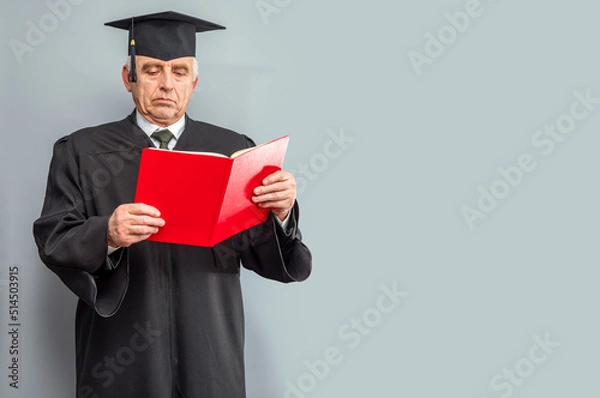 Fototapeta Academician, Professor, Prof is wearing a cap with Tassel and black gown. Senior educator or Doctor of Philosophy, learned man from a university or college