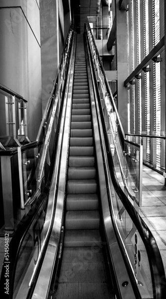 Fototapeta black and white image of a modern escalator in shanghai