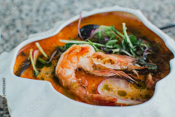 Fototapeta Soup with shrimp and seafood close-up
