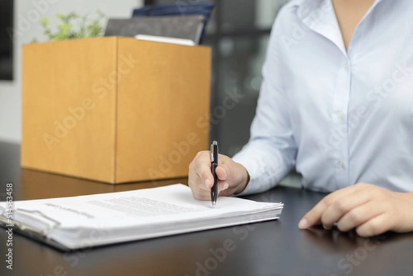 Fototapeta Sign the termination contract, resignation letter sign, End of the employment contract or termination of employment, Move to a new job, Take the pressure of the work that can't be done