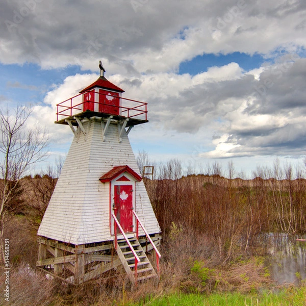 Fototapeta lighthouse in a field