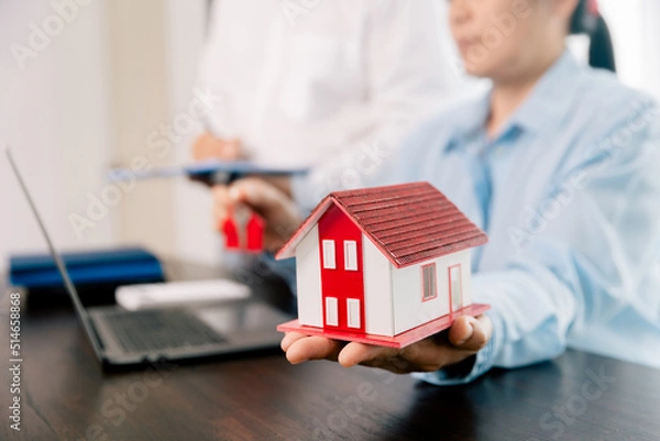 Obraz Real estate brokers or real estate agent with client or architect team Discussions about contracts , Saving money to invest in house or property in the future. Business property Concept.