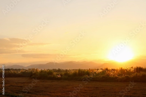 Obraz The sun setting down behind the mountain.
