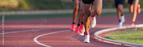 Fototapeta Athletics people running on the track field.Running a race on a track for sports competition and winning