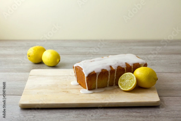 Obraz A glazed and unsliced lemon loaf cake