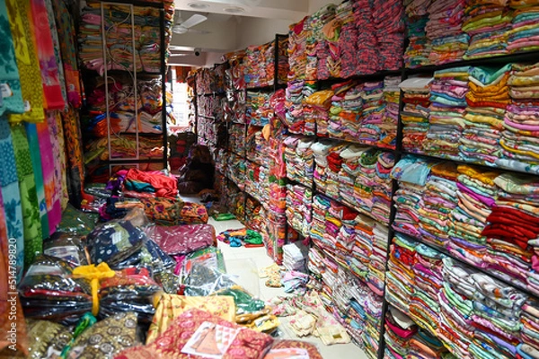 Obraz Saree store selling various types of sarees in shop. Ethnic woman clothing in India.