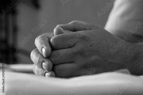 Fototapeta men's hands are folded in a lock in black and white