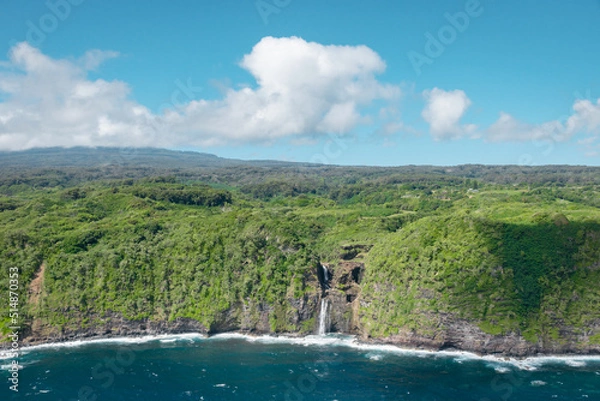 Fototapeta An aerial view of a waterfall spilling into the ocean on the coast of the island of Maui, Hawaii.