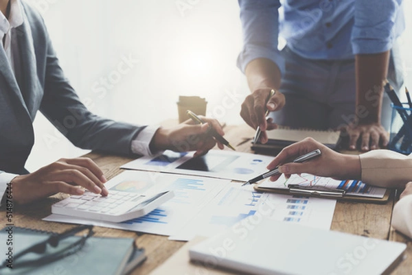 Fototapeta Meeting concept Business team hands at working with financial plan, meeting, discussion, brainstorm with tablet on the office desk, business financial concept.