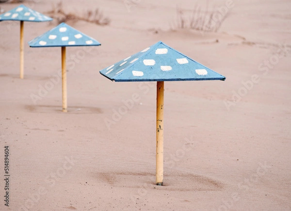 Fototapeta beach umbrellas. swimming is prohibited and spoiled vacation due to bad weather. dangerous beach for tourists.