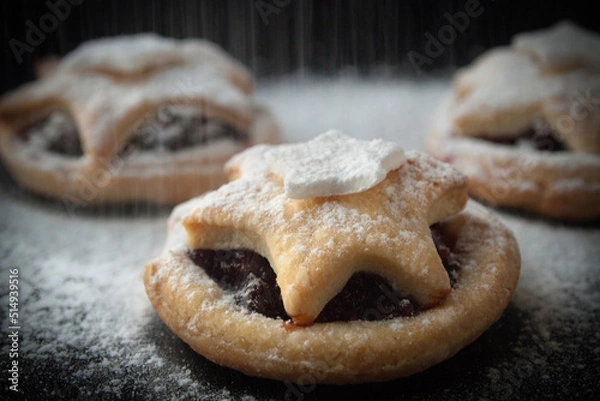 Obraz Christmas stars cookies on a dark background, close up with, snowfall effect