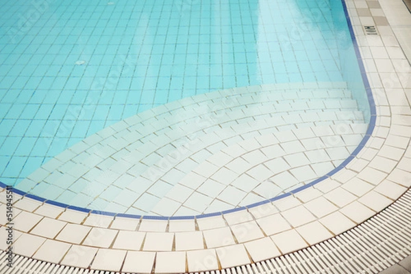 Fototapeta an empty swimming pool with poll stair