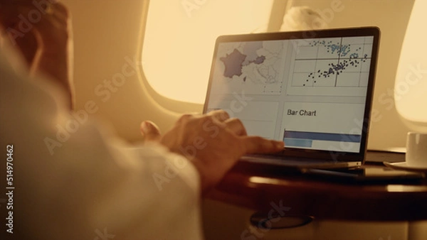 Fototapeta Manager hands working graphs on laptop computer closeup. Man using touchpad