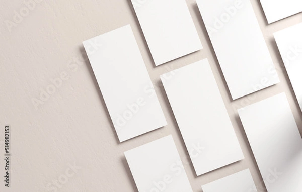 Obraz Multiple DL flyers mockup blank paper on a neutral background. White empty leaflet template in 3D illustration. Stationery concept