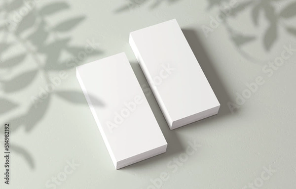Fototapeta Stacks of flyers mockup blank paper for design presentation. White empty leaflet template with plant shadow on the background in 3D illustration. Stationery concept