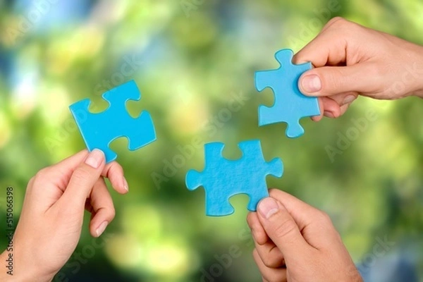 Obraz ESG concept of environmental, social, and governance. Hand of people holding a piece of jigsaw puzzle in solving environmental, social