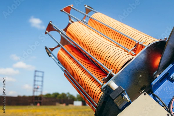 Obraz Close up plat machine with orange shooting plate for shooting-ground training on field with grass