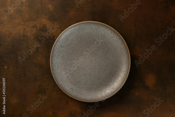 Obraz beautiful gray plate on a dark background