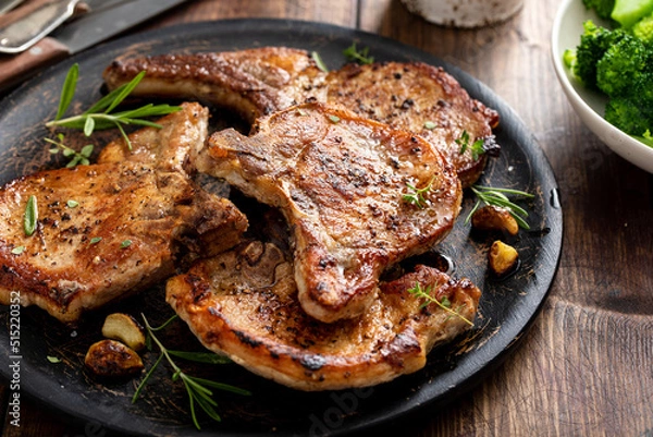 Fototapeta Grilled or pan fried pork chops on the bone
