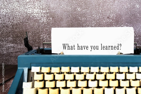 Fototapeta What have you learned words typed on an old typewriter. New year concept.