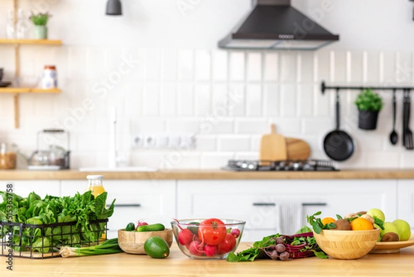 Fototapeta Kitchen table with various fresh vegetables and fruits for healthy and diet food with space for your product or text