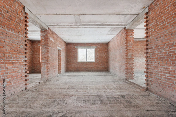 Fototapeta interior of the apartment without decoration in gray colors. rough finish