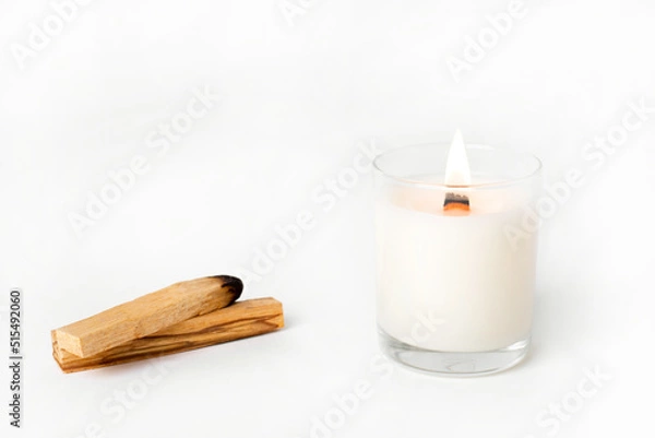 Fototapeta Soy candles in glass cans, handmade modern hobby , harmless coconut wax candles without paraffin with wood on white background isolated