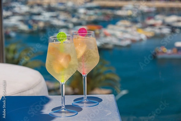Fototapeta Two Cocktail drinks over looking a marina, Roof top bar