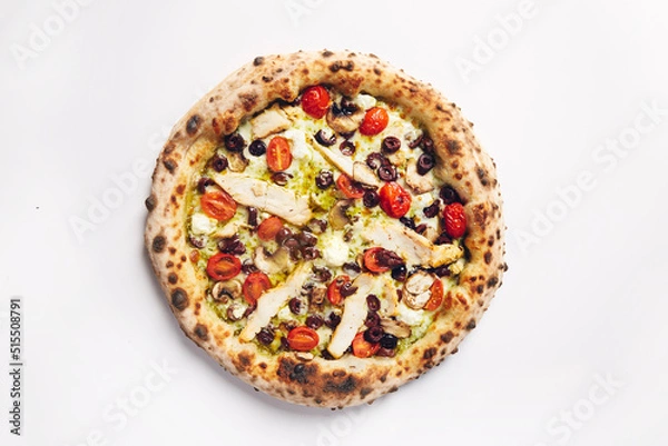 Obraz Top view of pizza topped with tomato, chicken, olives and mushrooms on a white background