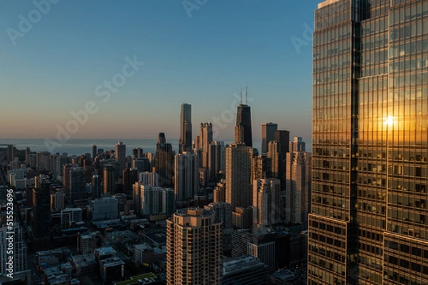 Fototapeta Drone, aerial view of a Chicago Skyline and Lake Michigan during sunset